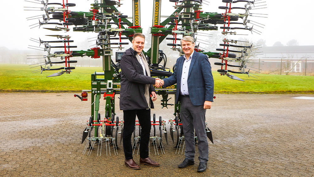 Väderstad's CEO Henrik Gilstring in front of a Thyregod inter-row cultivator.